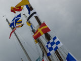 Nautical Flags Hanging from the Wooden Mast of a Sailing Ship  Mystic  Connecticut