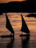 Sunset on the Nile River with Silhouetted Boats in Egypt