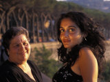 Two Women Look Out During Sunset in Naples  Italy