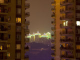 Neon Outlined Buildings in Distance Behind Balconied Apartment Blocks  Chongqing  China