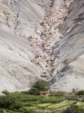 Landslide Boulders Perched Threateningly above Small Building  Chile
