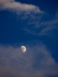 The Moon Surrounded by Cirrus Clouds against a Blue Sky  Groton  Connecticut
