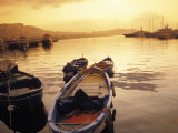 Sunset Setting over Two Boats at a Fishing Harbour and Marina on the Bay of Naples in Naples  Italy