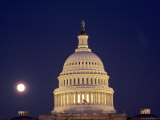 US Capitol Building Lit Up against the Night Sky with Full Moon  Washington  DC