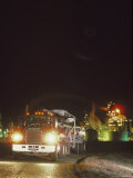 Trucker Traveling Down the Road at Night