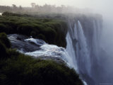 The Iguazu River Cascades over the Precipace into the Misty Abyss