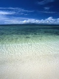 Seacape with Tropical Island on the Horizon  Blue Sky and Clouds