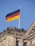 The German Flag Flies High above the New Reichstag in Berlin  Germany