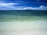 Secluded White Sands Beach on a Tropical Island with Blue Sky  Clouds