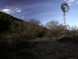 Windmill Situated Alongside a River in a Field in Late Winter  Australia