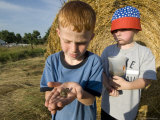 Two Young Kids Look at a Plains Leopard Frog  Greenleaf  Kansas