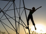 Woman Climbing a Steel Tower  Barstow  California