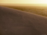 Wind Blasts Sand Across the Top of a Remote Coastal Dune at Sunset  Australia