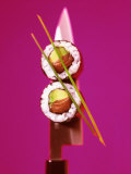 Two Maki-Sushi with Avocado and Salmon on Knife