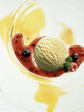 A Scoop of Vanilla Ice Cream with Berry Sauce