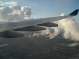 Wing of Airplane over Clouds  Copenhagen  Denmark