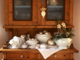 White Crockery with Christmas Decoration on Kitchen Cabinet