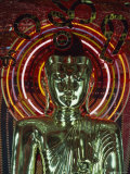 Waist-Up Shot of a Uniquely Designed  Green Metallic Buddha