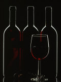 Silhouette of Three Red Wine Bottles and One Red Wine Glass