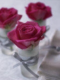 Table Decoration of Red Roses in Glasses