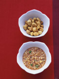 Honey Peanut Sauce and Peanuts in Small Bowls