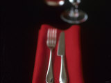Knife and Fork on Red Napkin