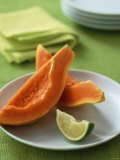 Two Papaya Wedges on a Plate