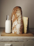 Milk Bottle  Bread and Cheese on a Wooden Cupboard