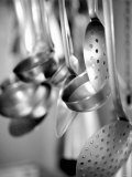 Ladles and Slotted Spoons Hanging up in a Kitchen