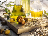 Various Oils in Carafes  Olives  Sunflower Seeds