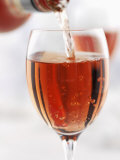 Pouring Rose Wine into Wine Glass