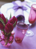 Red Tulips in Small Vase Beside Place Setting
