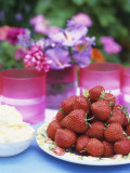 Fresh Strawberries and Whipped Cream on a Garden Table