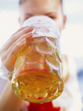 Young Woman Drinking a Litre of Beer at October Fest (Munich)
