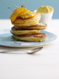 Pancakes with Orange Slices and Maple Syrup