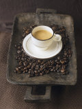 A Cup of Espresso on a Wooden Bowl with Coffee Beans