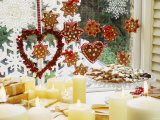 Christmassy Window Decorated with Biscuits and Candles