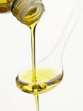 Pouring Olive Oil Over a Spoon