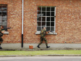 Belgian Soldiers on Patrol around a Suspect Building