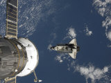 Space Shuttle Endeavour Backdropped by a Blue and White Earth