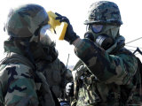 Soldier Assisting Fellow Soldier During Decontamination Process