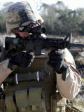 Soldier Looks Through the Scope of M-4 Carbine Rifle