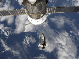 Space Shuttle Endeavour Backdropped by a Blue and White Earth