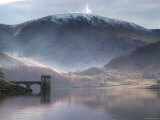 Reflective Water Landscape in Front of Snowcapped Mountain