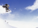 Man on Snowboard Jumping