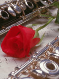 Clarinet and Flute on Sheet Music with Rose
