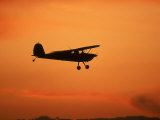 Silhouette of Small Airplane in Flight