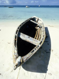Wooden Row Boat Lying on Beach
