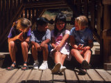 Children Sitting in Playground