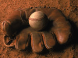 Baseball Glove with Ball on Dirt